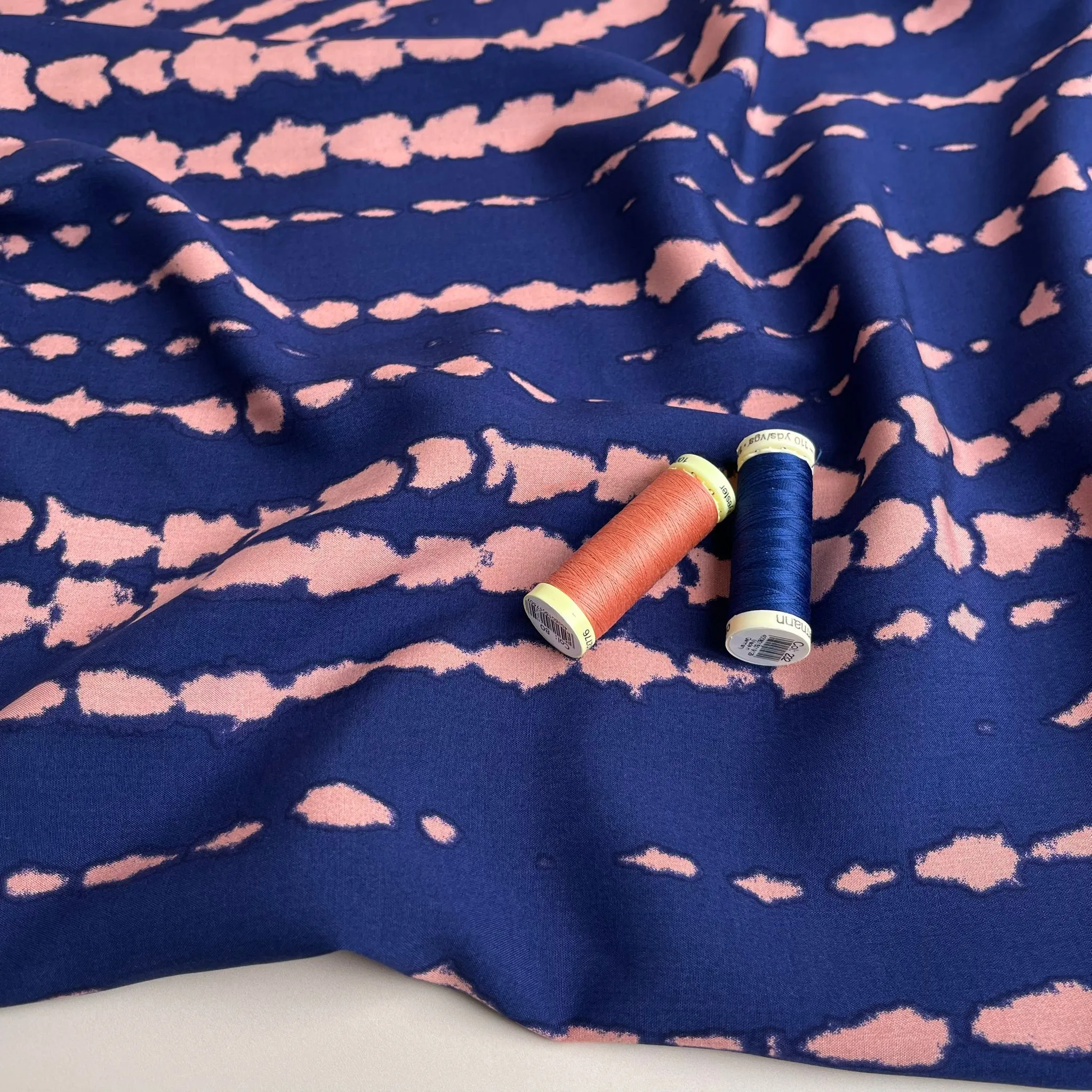 Broken Lines in Peach on Navy Viscose Fabric