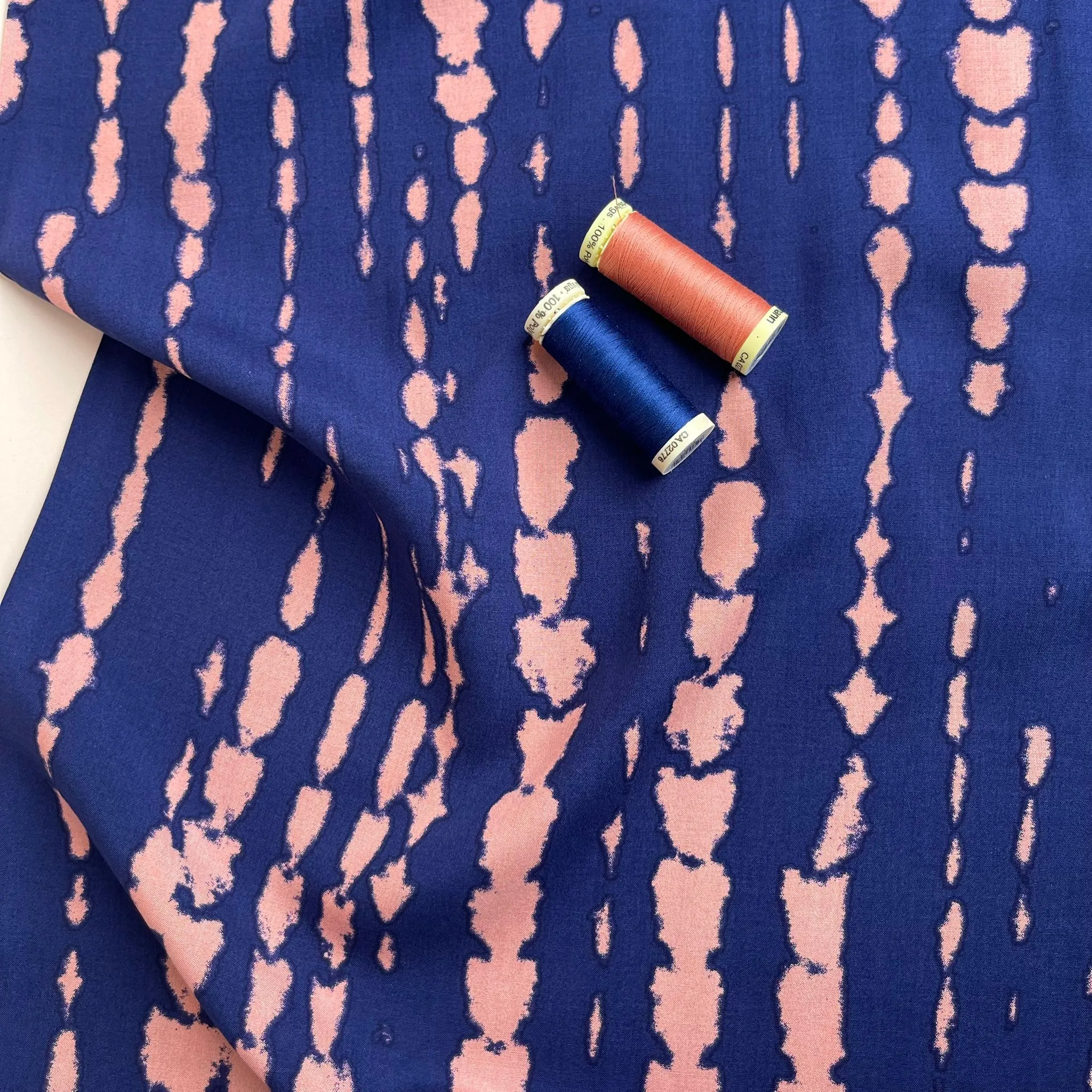 Broken Lines in Peach on Navy Viscose Fabric