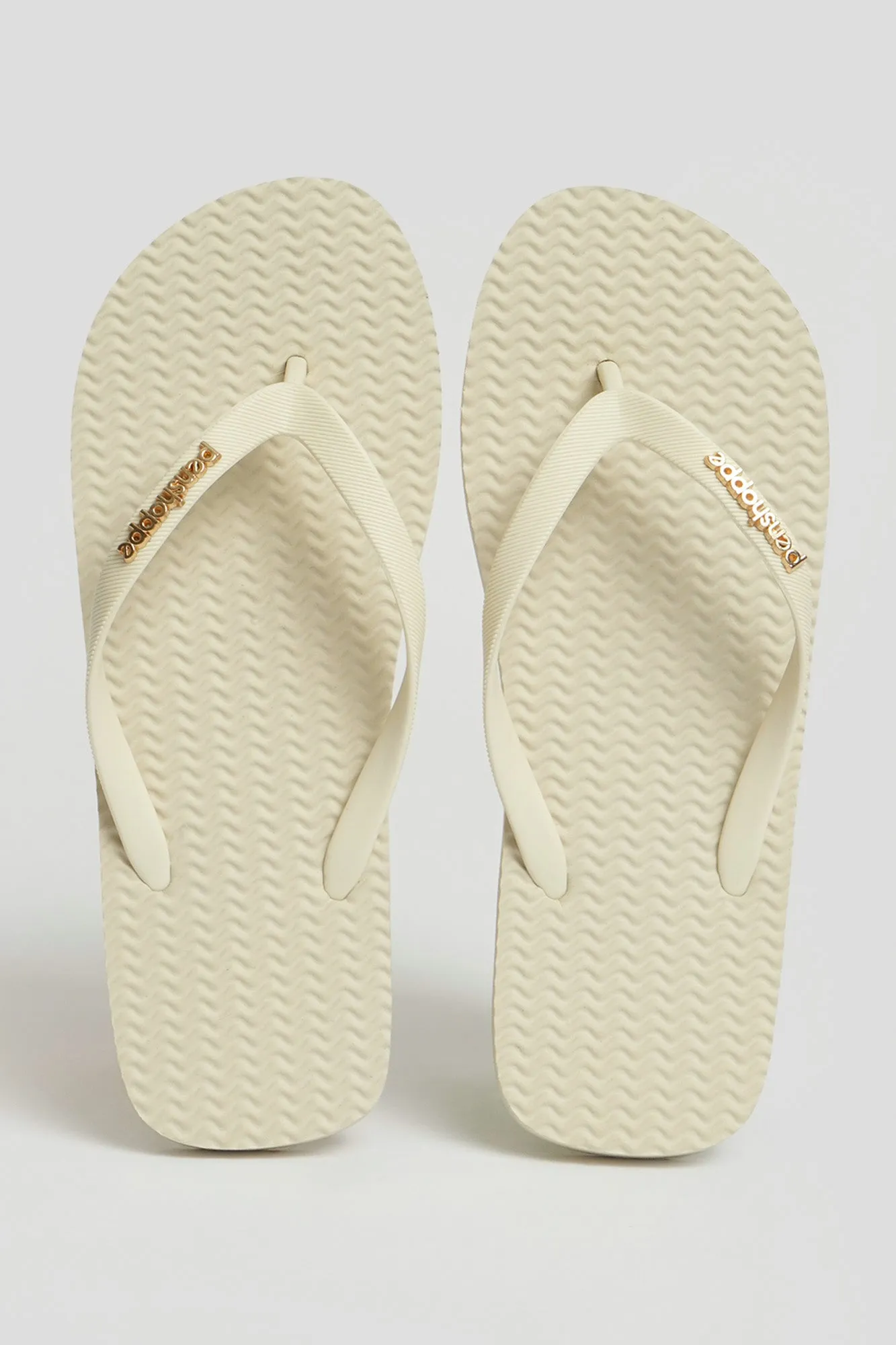 Women's Textured Sole Flip Flops with Metal Branding