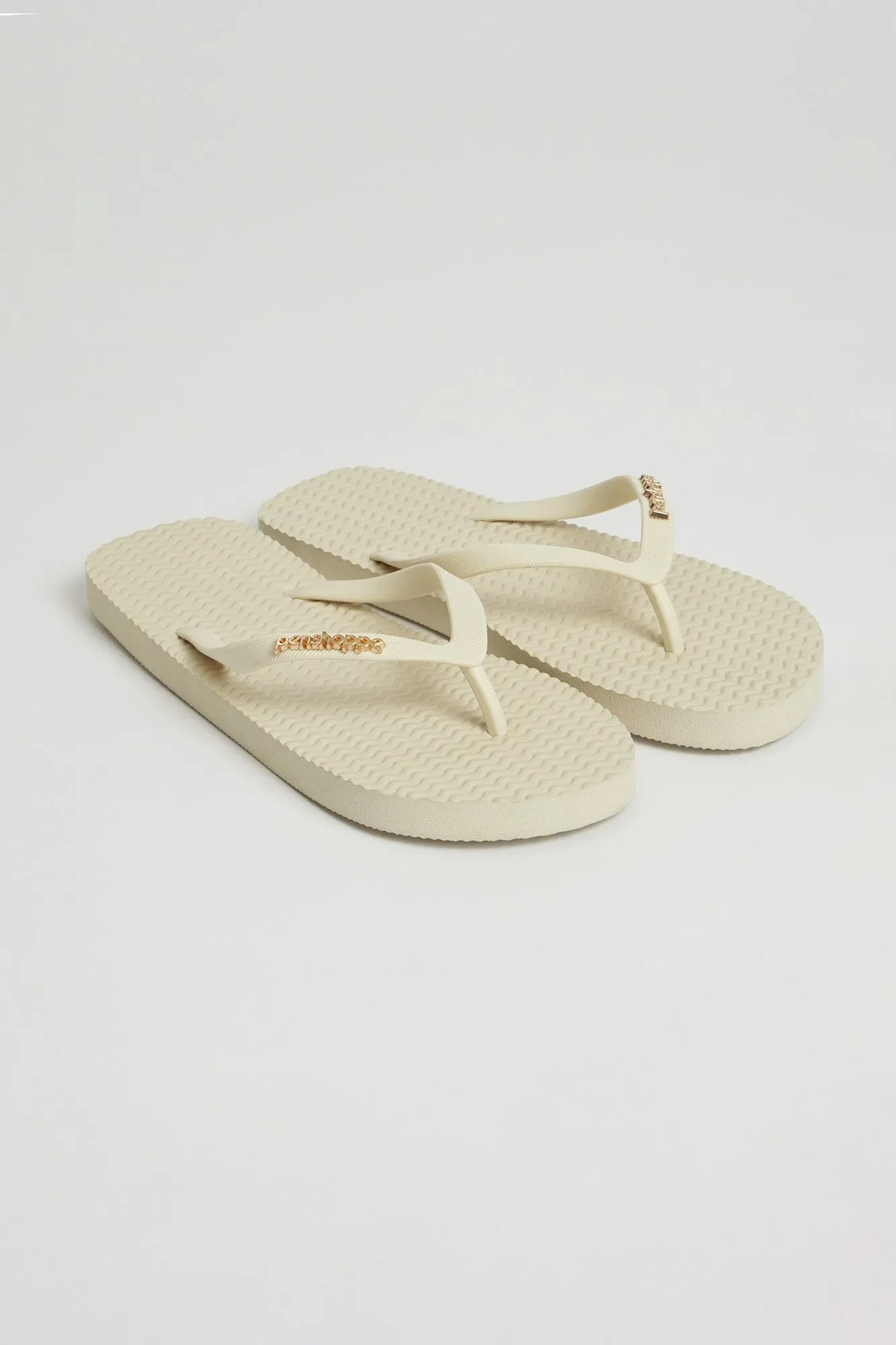 Women's Textured Sole Flip Flops with Metal Branding